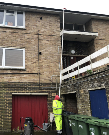 Frome roof cleaning with a pressure washer